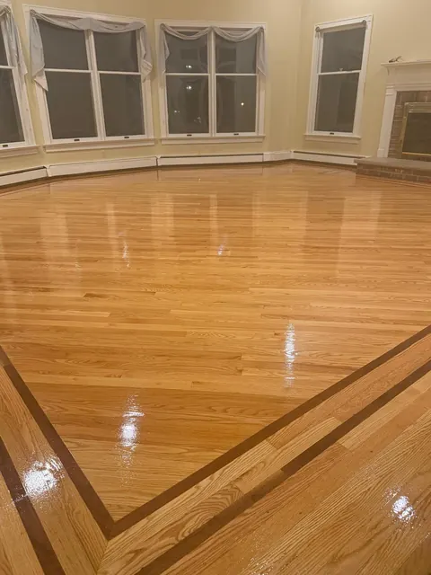 Bay window room with refinished oak and dark border inlay