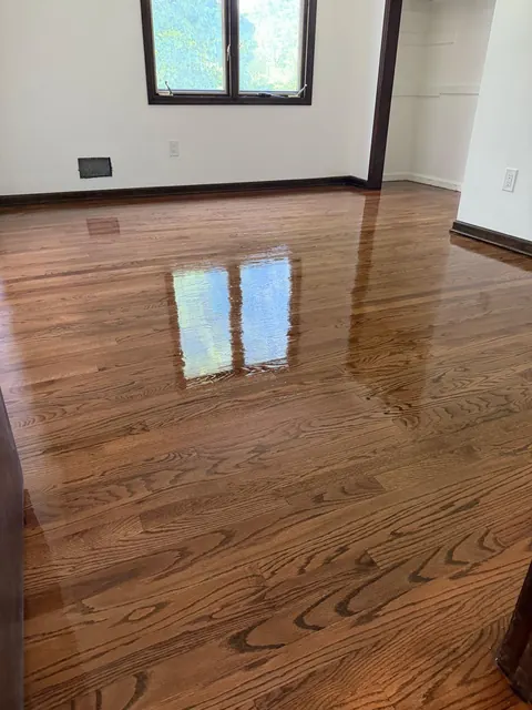 Oak floor refinished with a rich brown stain, high gloss