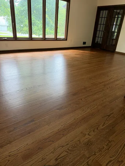 Living room oak floor refinished in a medium brown stain